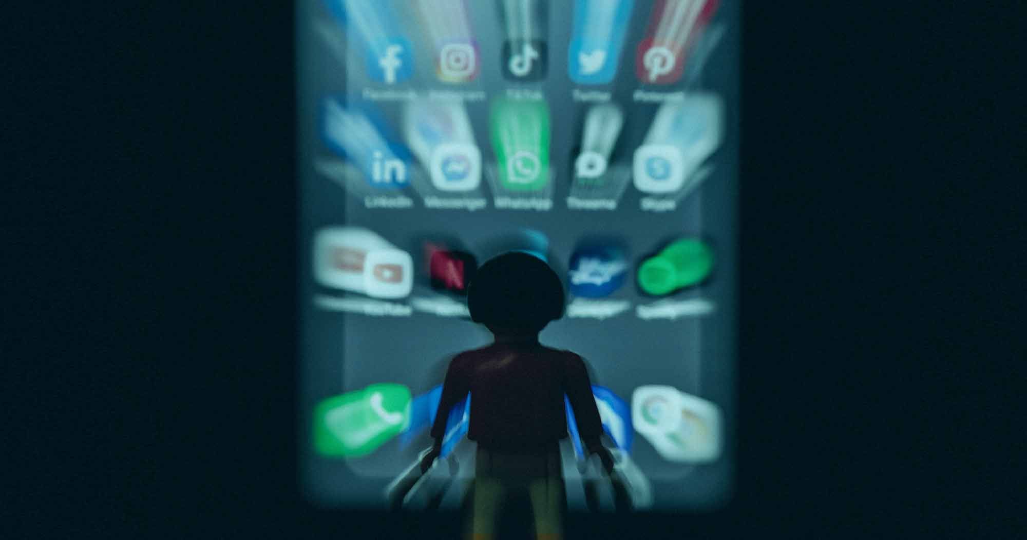 Lego Person being drawn in by social media icons